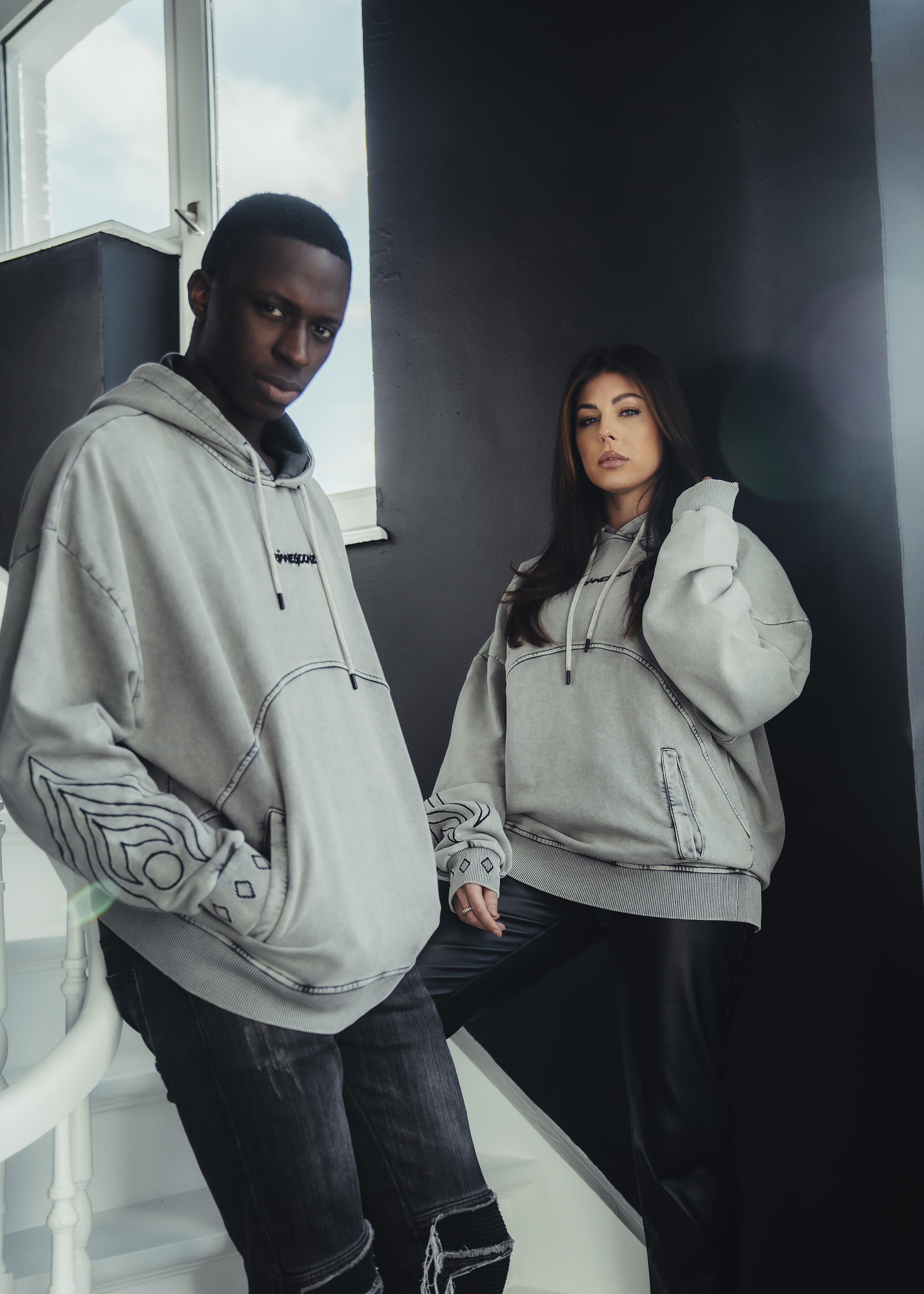 Male and female wearing the vintage hoodie